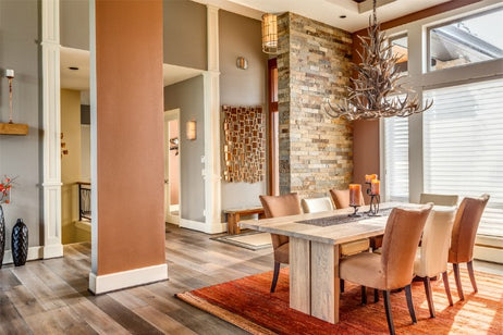 An image of a dining room with a rug