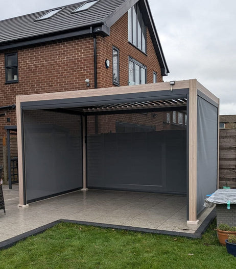 LuxShade™ 3x4m Aluminium Pergola - LEDs, Double-Layer Louvres & 3 Windscreens - Oak Effect