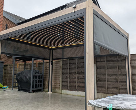 LuxShade™ 3x3m Aluminium Pergola - LEDs, Double-Layer Louvres & 3 Windscreens - Oak Effect